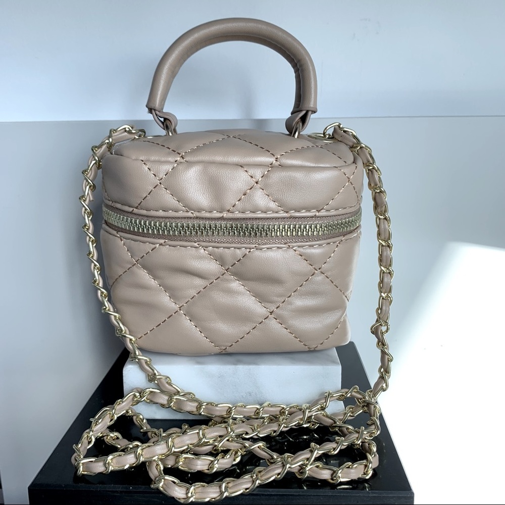 Mini Beige Diamond Stitch top handle mini bag with gold chain.